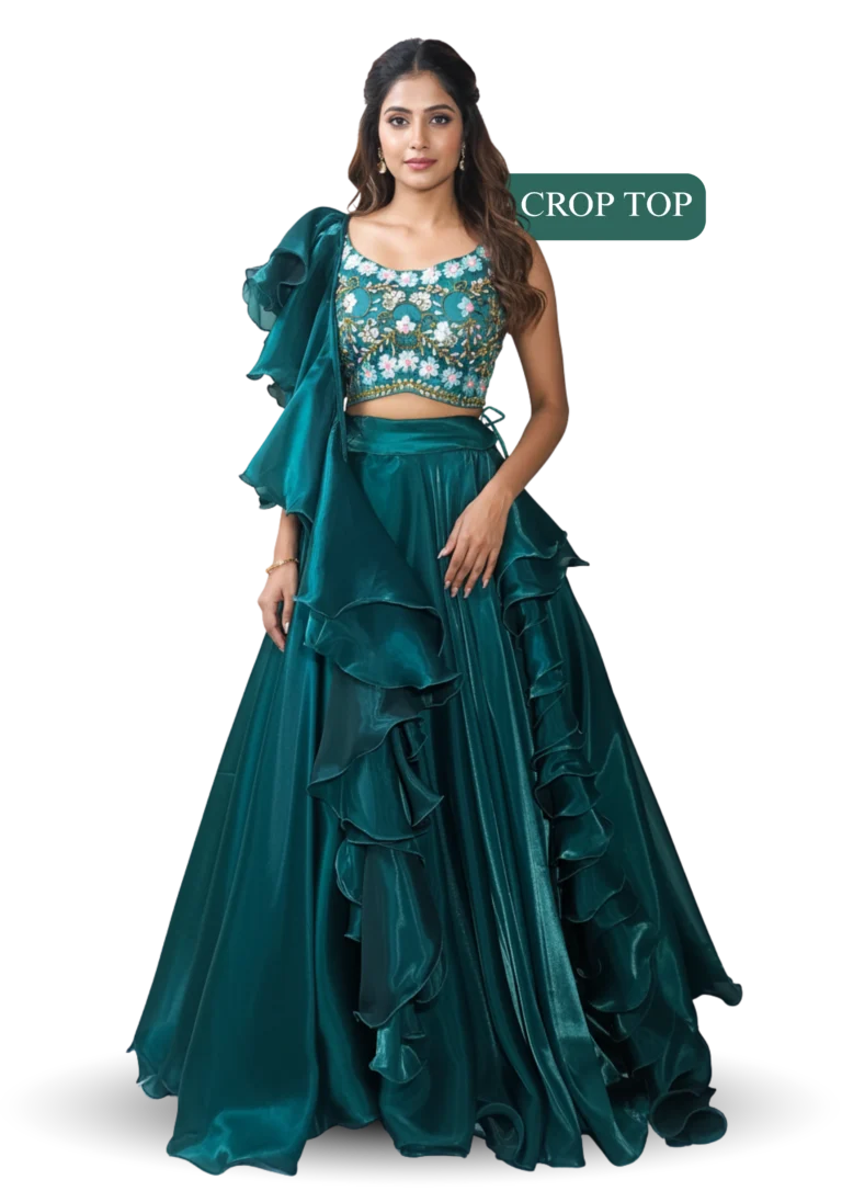 Woman wearing teal embroidered crop top lehenga with ruffled skirt and elegant festive ethnic wear design.